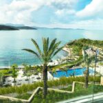 best luxury resorts in the Mediterranean along a scenic coastline with resort pool and sea views